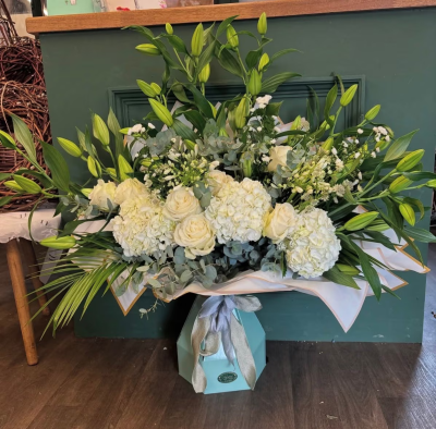 The Ultimate Lily Deluxe - For the lily fans out there.. the ultimate deluxe filled with the freshest lily’s, neutral hydrangeas & luxury roses *please note the image shows the deluxe size *