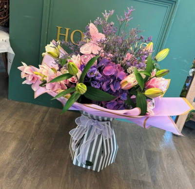 Purple Dreams - For all those purple lovers out there, this one is for them! A beautiful aqua box will with different shades of purples & lilacs please add in the comments if you would like lily's adding or not. Please note each bouquet will vary on flowers types as we will only use the freshest available & will vary day to day, but it will all be within the colour scheme chosen by you! *photo shows deluxe size aqua*